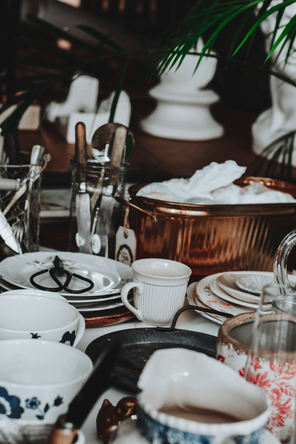 Assortment of vintage dishes and kitchenware on a table.