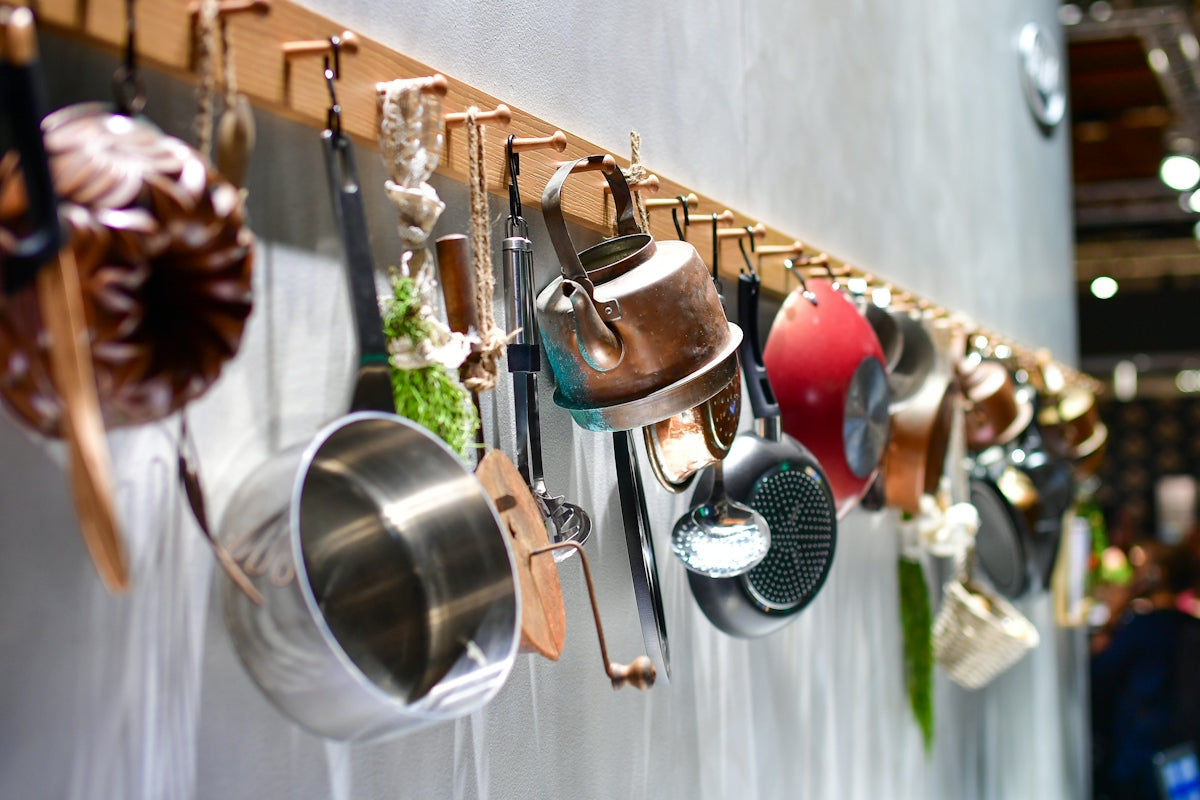 Various kitchen utensils hanging on a rack