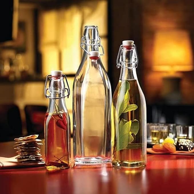 Bormioli Rocco Swing Top Glass Bottle (Set of 2) - 17 oz Reusable Container with Secure Metal Clasp, Ideal for Homemade Juices, Oil Infusions, Condiments, Mixers - Everyday Drinking Glasses