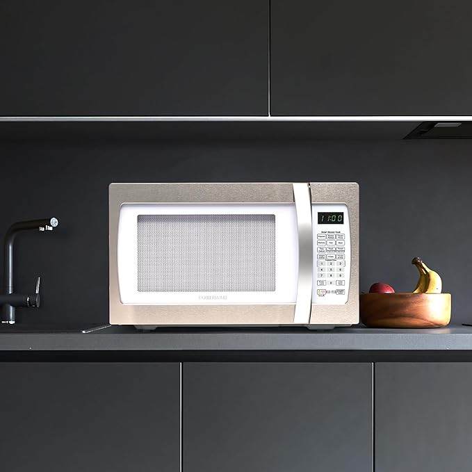 Farberware 1.3 Cu. Ft. Countertop Microwave Oven – 1100 Watts Power, Smart Sensor Auto Cook Settings, Defrost, Easy Clean and Child Safety Lock - White Platinum