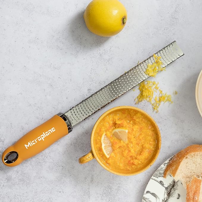 Microplane Premium Zester Grater in Mustard | Lemon Zester tool, Hard Cheese & Vegetable Grater | For Citrus, Parmesan Cheese, Garlic, Ginger, Nutmeg | Fine Stainless Steel Blade, Made in USA