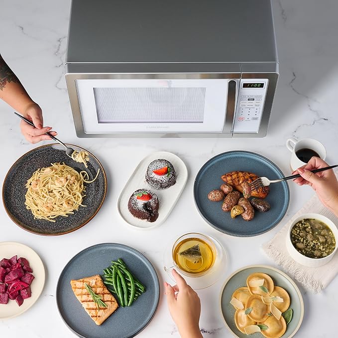 Farberware Countertop Microwave Oven 1000 Watt Power Auto Cook Settings, Defrost, Easy Clean and Child Safety Lock, 1.1 Cu. Ft, White Platinum